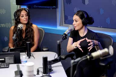 Jenni "Jwoww" Farley and Sammi Giancola in a Sirius XM studio; they're both waring black tops and black headphones