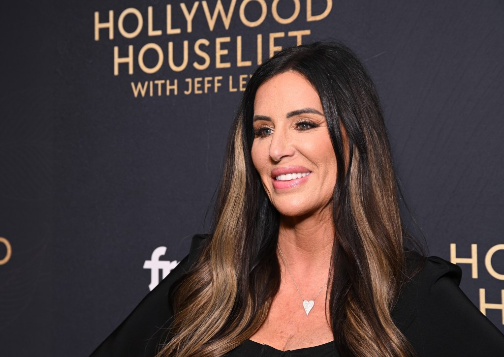 Patti Stanger posing at an event; she's smiling and wearing a black dress