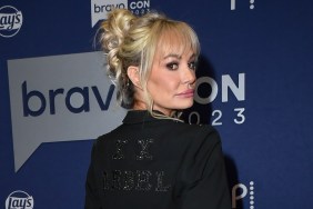 Taylor Armstrong in a black blazer doing an over the shoulder pose at BravoCon 2023