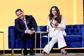 Paul Connel and Dolores Catania sitting together on a blue couch at BravoCon 2023