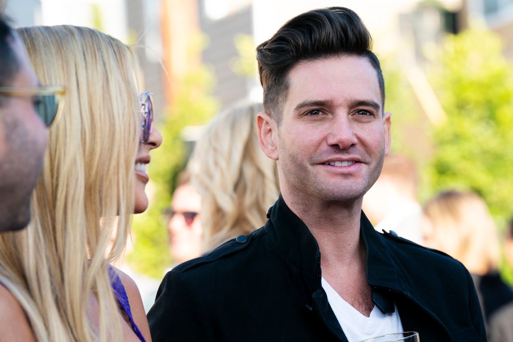 Josh Flagg standing with Tracy Tutor on MDLLA