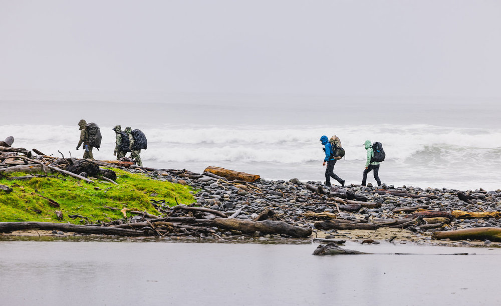 Racers running along a coast on Race to Survive: New Zealand