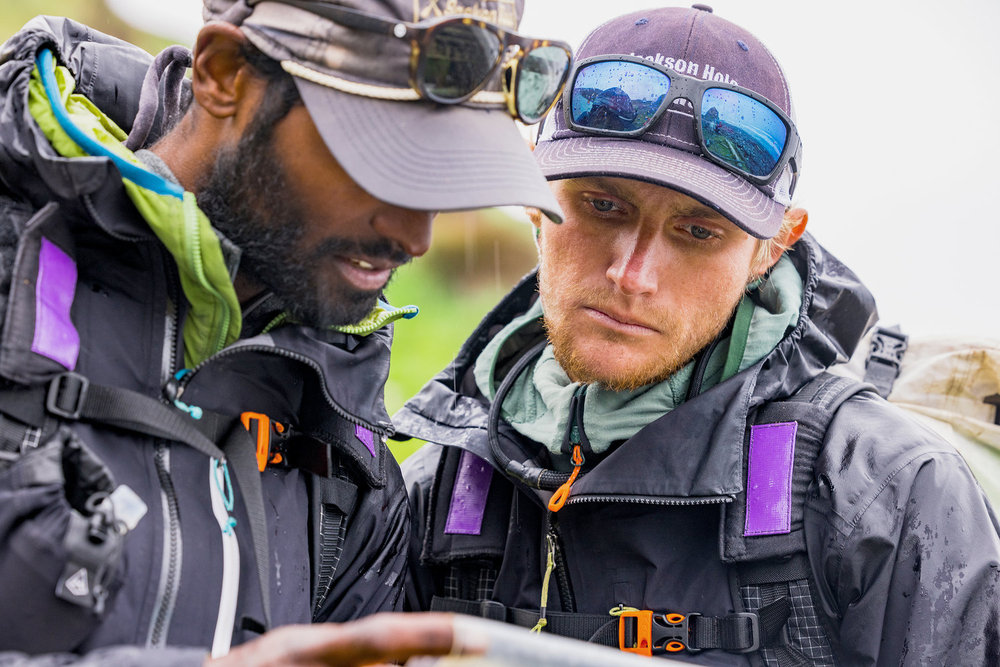 Corry and Oliver looking at a map on Race to Survive: New Zealand