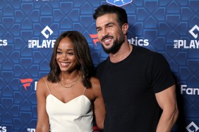 Rachel Lindsay in a white dress posing with Bryan Abasolo, who is wearing a black t-shirt