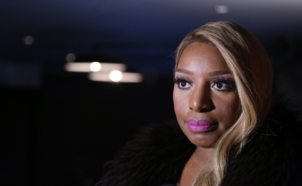 NeNe Leakes making a serious facial expression standing outside in New York City