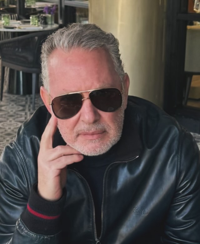 PK in a leather jacket and sunglasses