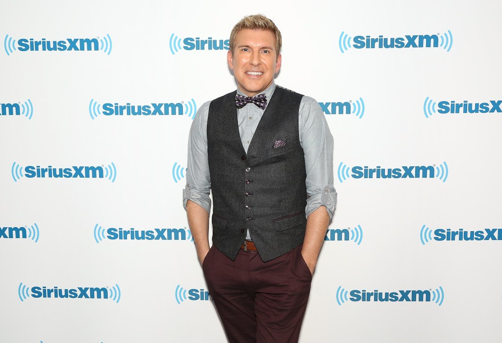 Todd Chrisley in a bow tie posing at SiriusXM studios