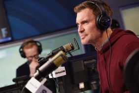 Jeff Lewis in a red sweater talking into a microphone on SiriusXM's Jeff Lewis Live