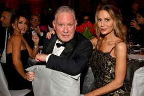 Dorit Kemsley and Paul Kemsley sitting at a table at a formal event