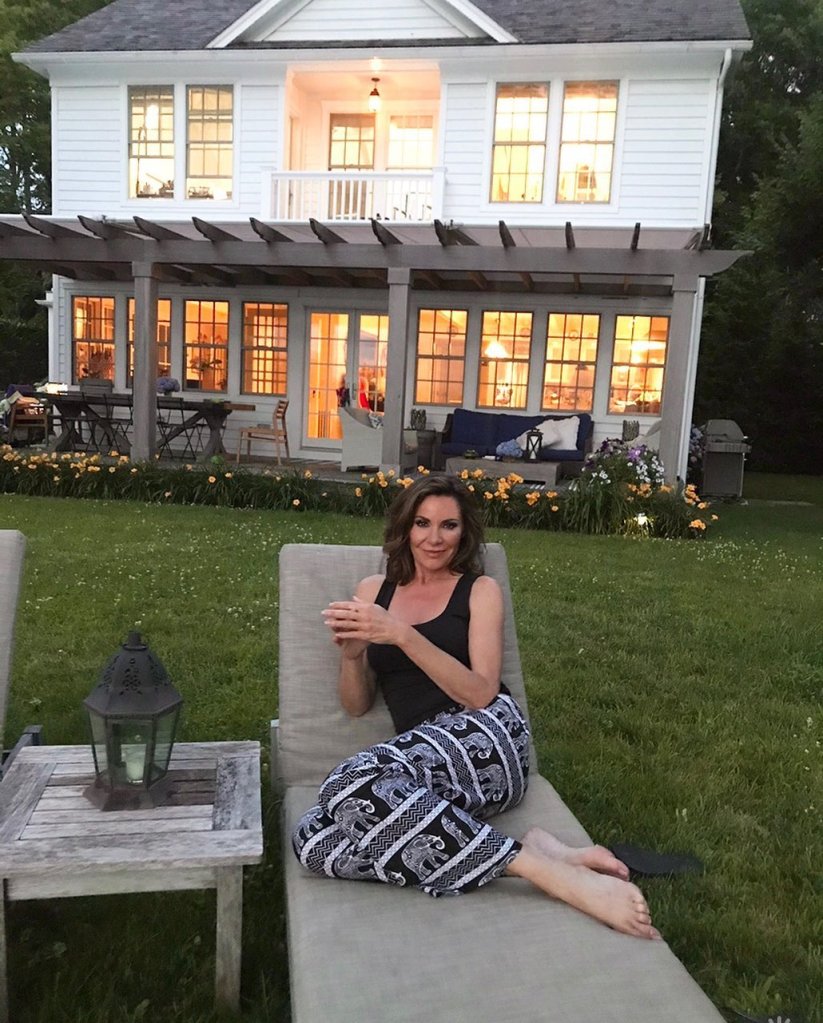 Luann de Lesseps sitting outside her home in the Hamptons