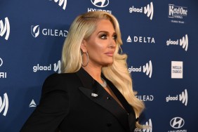 Side proflie picture of Erika Jayne wearing a black blazer