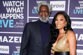 Angela Oakley and Charles Oakley posing backstage at Watch What Happens Live