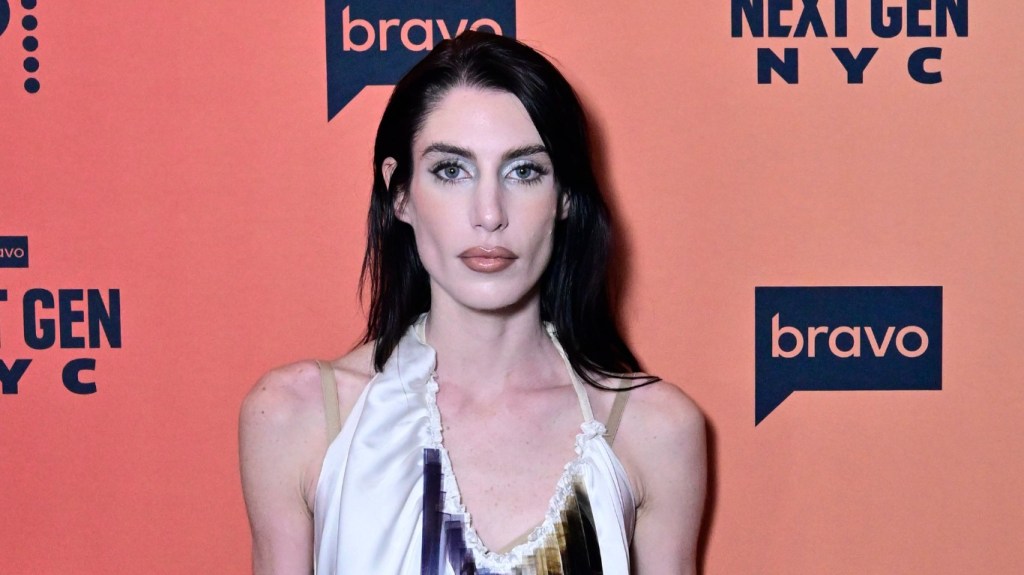 Georgia McCann in a white dress at the premiere of Next Gen NYC