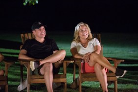 Todd Chrisley and Julie Chrisley sitting in lawn chairs with their legs crossed on Chrisley Knows Best